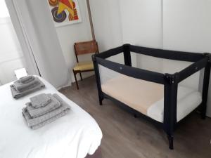 A bed or beds in a room at Tiny Monumental House in Down Town Leiden