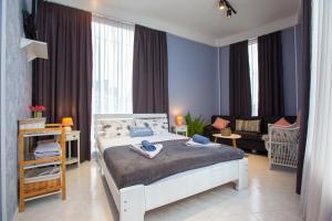Кровать или кровати в номере Shiny Avlabari Apartment