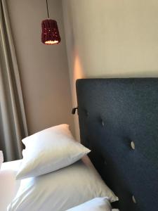 Ένα ή περισσότερα κρεβάτια σε δωμάτιο στο Klein Fein Hotel zum Graf
