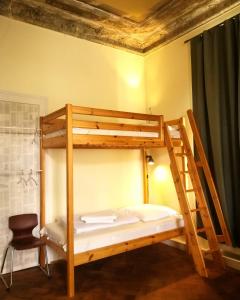 Ένα ή περισσότερα κρεβάτια σε δωμάτιο στο Casa Hostel Pirna