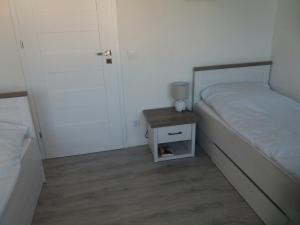 Postel nebo postele na pokoji v ubytování Apartament Thomas