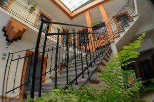 a spiral staircase in a building with a skylight at HOTEL DEL CAPITAN DE PUEBLA, DEPARTAMENTOS in Puebla