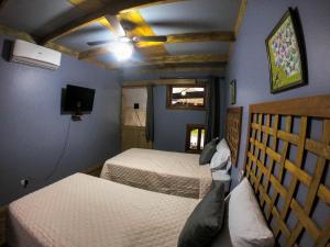 Postel nebo postele na pokoji v ubytování Hotel Hacienda Don Paolo