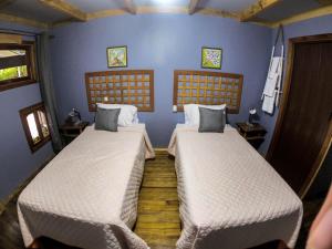Postel nebo postele na pokoji v ubytování Hotel Hacienda Don Paolo