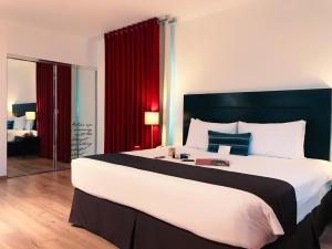Postel nebo postele na pokoji v ubytování El Polo Apart Hotel & Suites + 26 fotografií