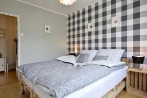 Posteľ alebo postele v izbe v ubytovaní Apartament Dzień Dobry 2
