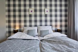 Posteľ alebo postele v izbe v ubytovaní Apartament Dzień Dobry 2
