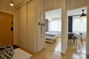 Posteľ alebo postele v izbe v ubytovaní Apartament Dzień Dobry 2