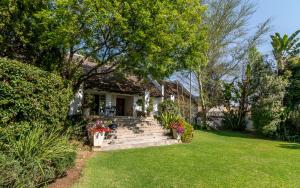 a house with stairs leading to the front yard at Green Park Manor in Johannesburg