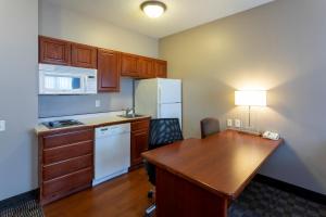 A kitchen or kitchenette at GrandStay Hotel & Suites Ames