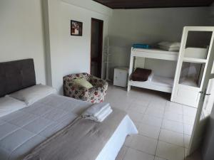 Postel nebo postele na pokoji v ubytování Pousada Três Coroas
