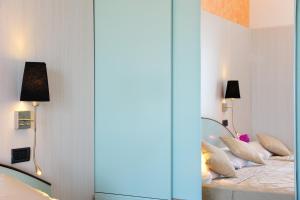 Postel nebo postele na pokoji v ubytování Hotel Vienna