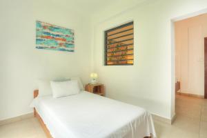Postel nebo postele na pokoji v ubytování Auberge SeaFever