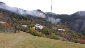 a house on the side of a mountain at Apibus Domus - Chris et Stèph in Guillaumes +8 photos