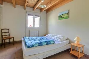 A bed or beds in a room at Gîtes "LA JUMEL" à 25 min du Touquet, à la Campagne et à la Mer