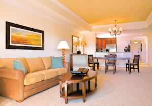 a living room with a couch and a table at WorldMark Reunion in Kissimmee