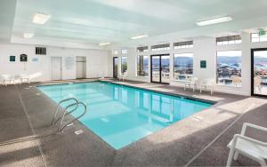 a large swimming pool with blue water in a building at WorldMark Arrow Point in Coeur d'Alene