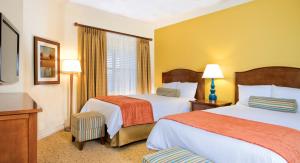 a hotel room with two beds and a window at WorldMark Reunion in Kissimmee +20 photos