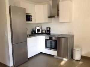 Kuchyň nebo kuchyňský kout v ubytování Le Pêcheur