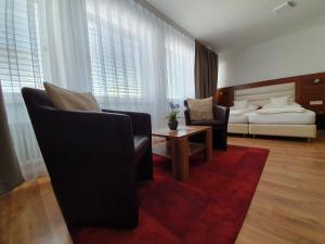 Postel nebo postele na pokoji v ubytování ZUM ZIEL Hotel Grenzach-Wyhlen bei Basel