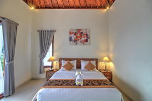 Postel nebo postele na pokoji v ubytování Arya Resort Nusa Penida