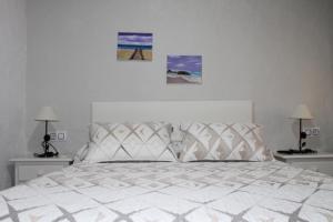 Postel nebo postele na pokoji v ubytování Hostal El Espinel