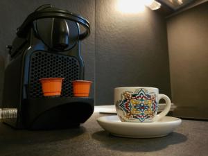 a coffee maker and a coffee cup on a counter at Spacious 110m2 2bedrooms 2bathrooms Center Athens in Athens