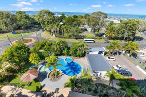 an aerial view of a park with a swimming pool at Akama Resort in Hervey Bay