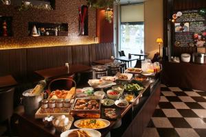 a buffet line with many different types of food at Hotel Quest Shimizu in Shizuoka