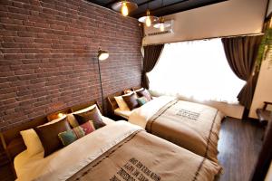 Posteľ alebo postele v izbe v ubytovaní TOMARIE Horikiri Residential Suite