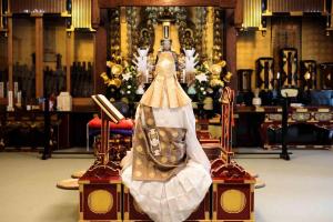 a dress sitting on a chair in a church at 宿坊 正伝寺 Temple hotel Shoden-ji in Tokyo