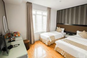 Ένα ή περισσότερα κρεβάτια σε δωμάτιο στο Riverside Boutique Hotel
