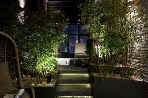 a garden with plants and stairs in a room at 9 Brick Hotel in Seoul