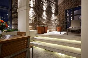 a room with stairs and a brick wall at 9 Brick Hotel in Seoul