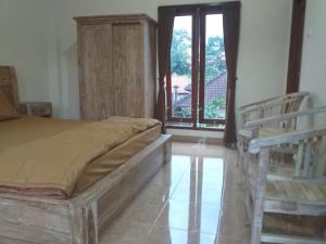 Postel nebo postele na pokoji v ubytování Yuda Homestay