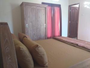 Postel nebo postele na pokoji v ubytování Yuda Homestay
