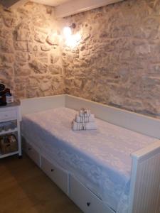 a bedroom with a bed with towels on it at Il Castello in Casamassima