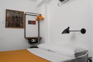 Postel nebo postele na pokoji v ubytování Gomez House