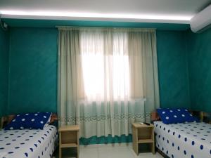 Ліжко або ліжка в номері Apartmani Spasic