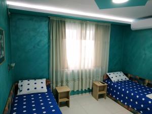 Ліжко або ліжка в номері Apartmani Spasic