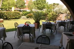 a group of tables and chairs in a restaurant at Ariete in Ponsacco