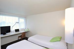 Postel nebo postele na pokoji v ubytování Campanile Reims Est - Taissy + 14 fotografií