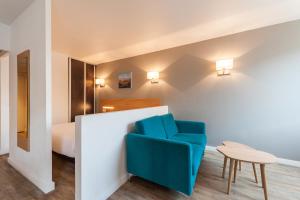 Ένα ή περισσότερα κρεβάτια σε δωμάτιο στο Residhotel Le Grand Prado