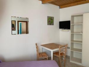 TV a/nebo společenská místnost v ubytování B&B S'Incontru