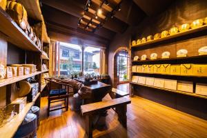 a room with a table and shelves of dishes at Home Away From Home in Shangri-La