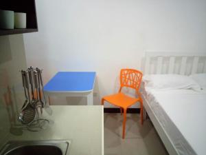 Postel nebo postele na pokoji v ubytování Clark-Pad Inn, Angeles City