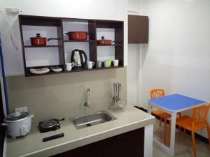 Kuchyň nebo kuchyňský kout v ubytování Clark-Pad Inn, Angeles City