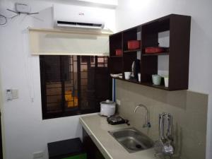 Kuchyň nebo kuchyňský kout v ubytování Clark-Pad Inn, Angeles City