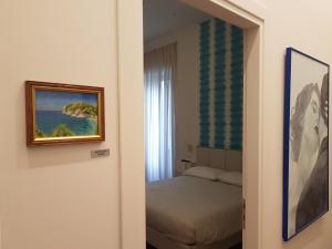 A bed or beds in a room at Mythos Holidays