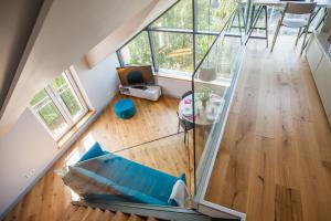 an overhead view of a living room with a glass floor at Penthouse in the City Center in Vilnius